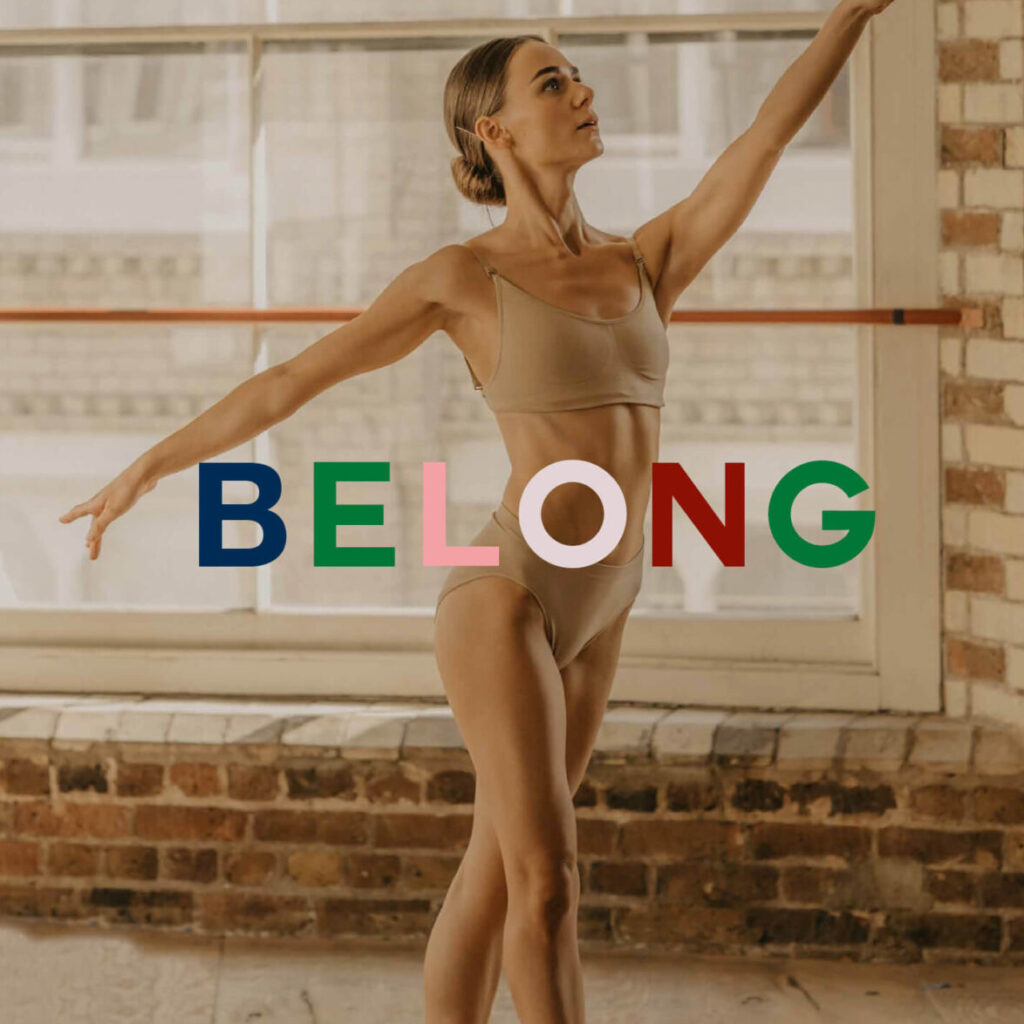 Ballet dancer in studio at Menier Venues with “Belong” text overlay
