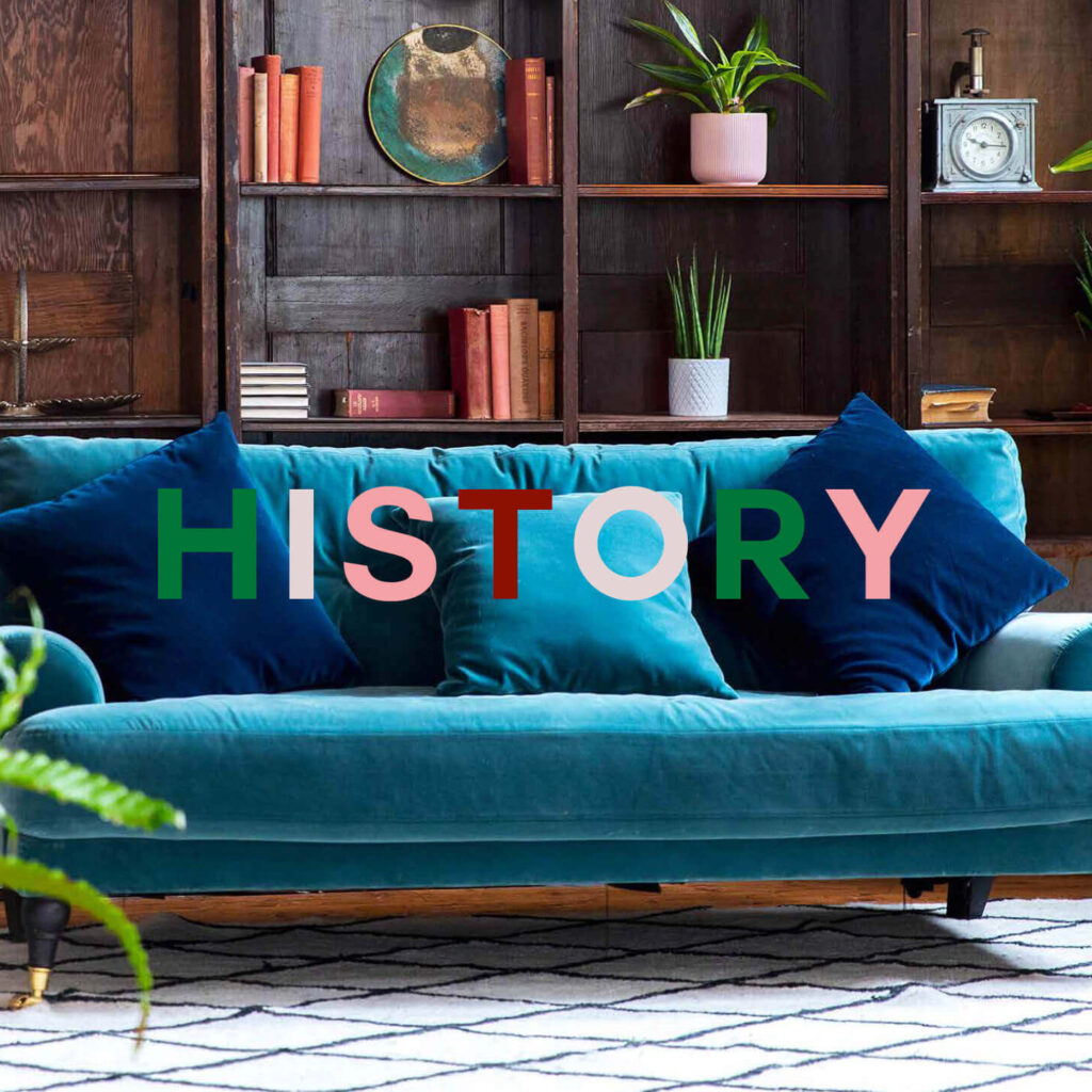 Blue velvet sofa in heritage lounge area at Menier Venues with “History” text overlay