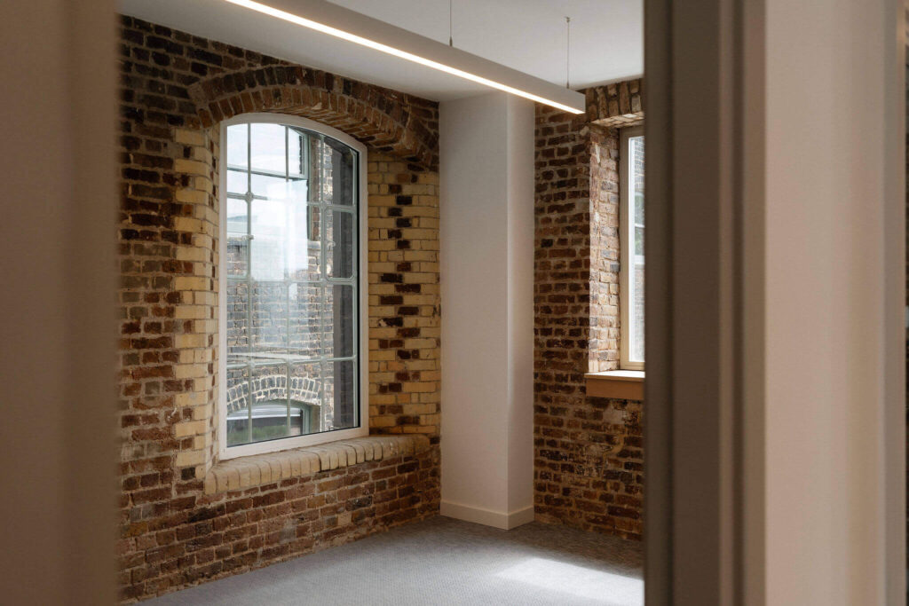 Brick wall office corner with arched windows