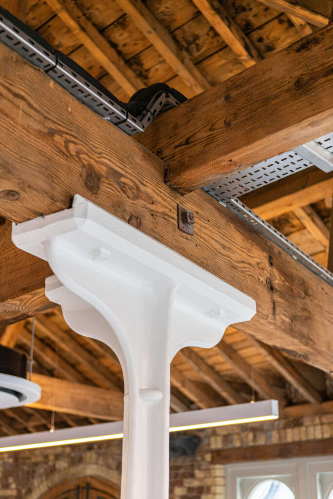 Cast iron column with timber beam industrial detail