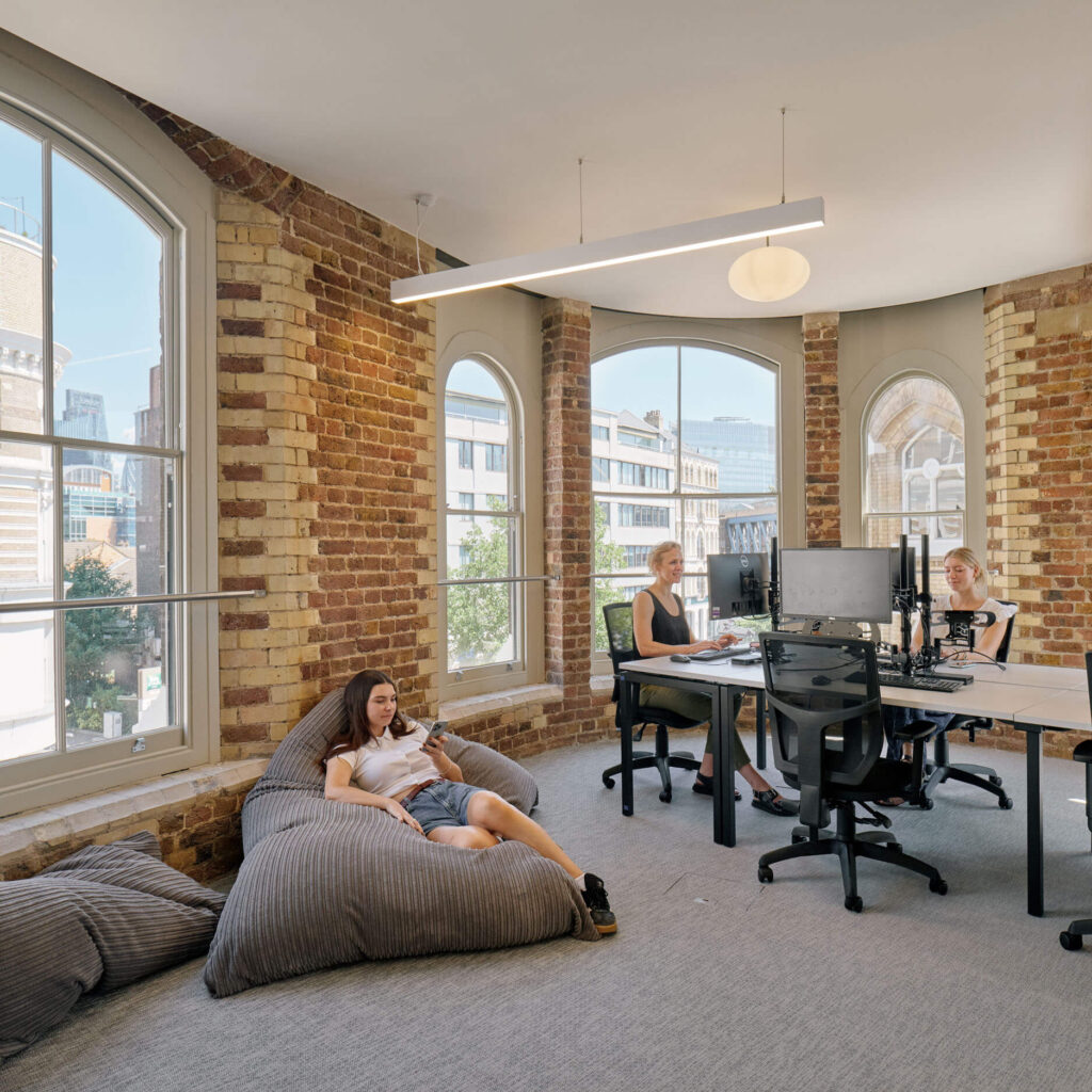 Collaborative office space with beanbags and arched windows at Menier Venues