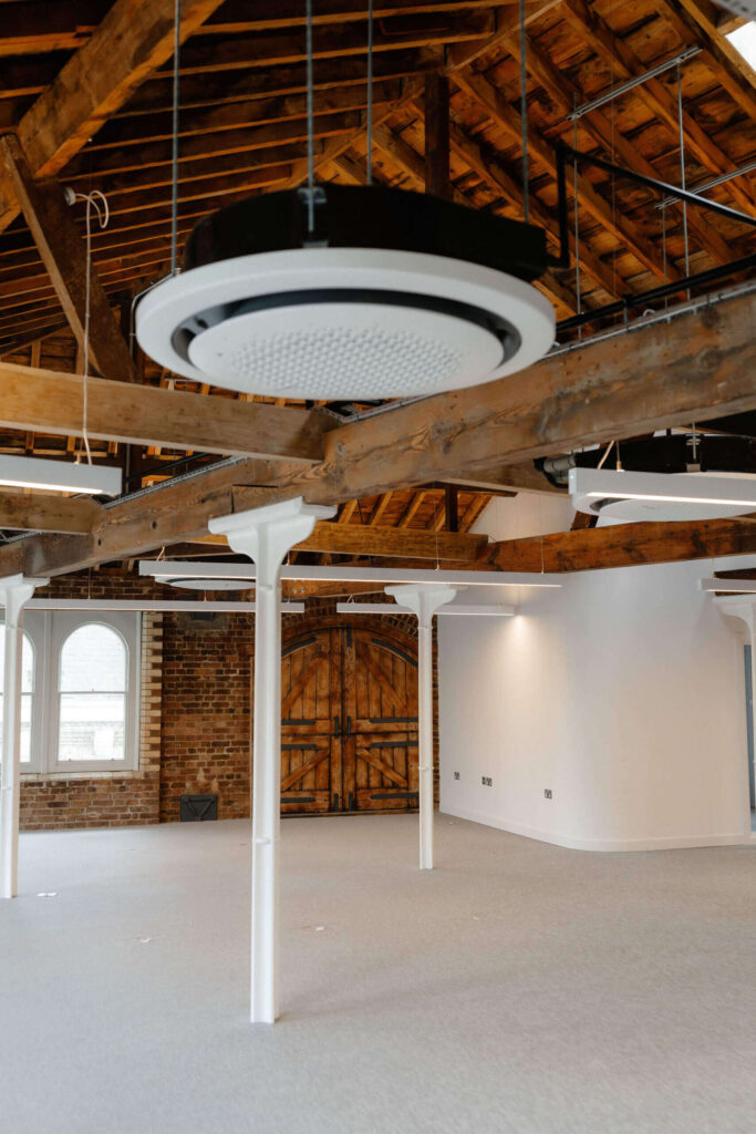 Exposed timber roof in modern office renovation with industrial style
