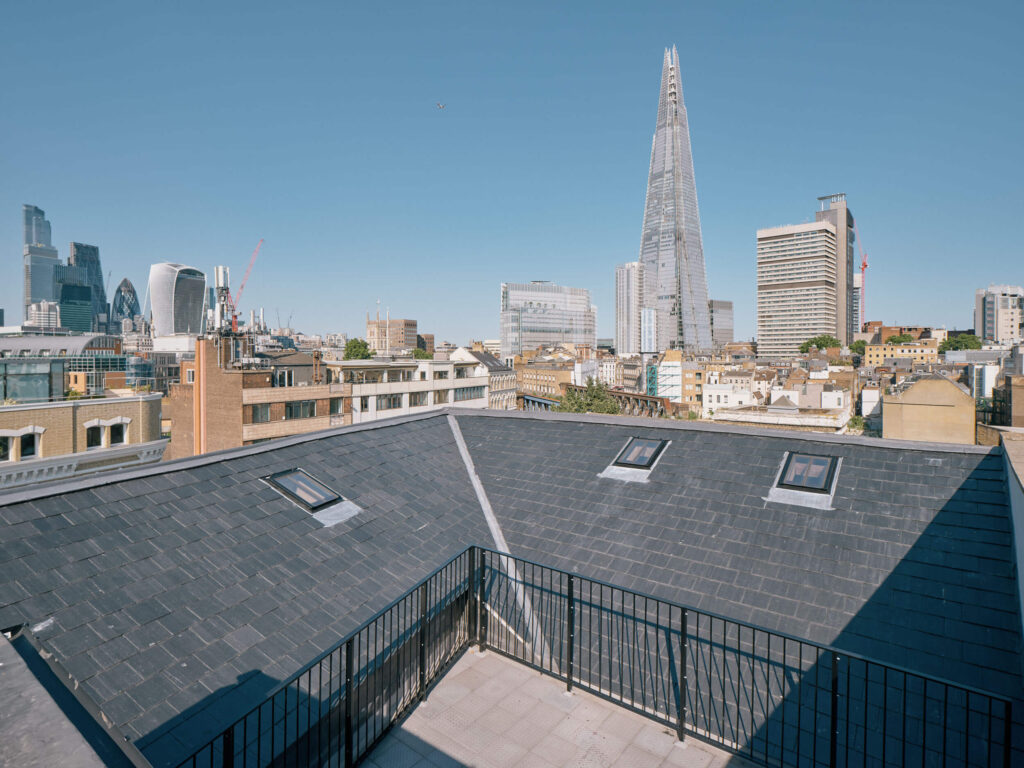 London city rooftop terrace view with the Shard, Gherkin, and Walkie Talkie