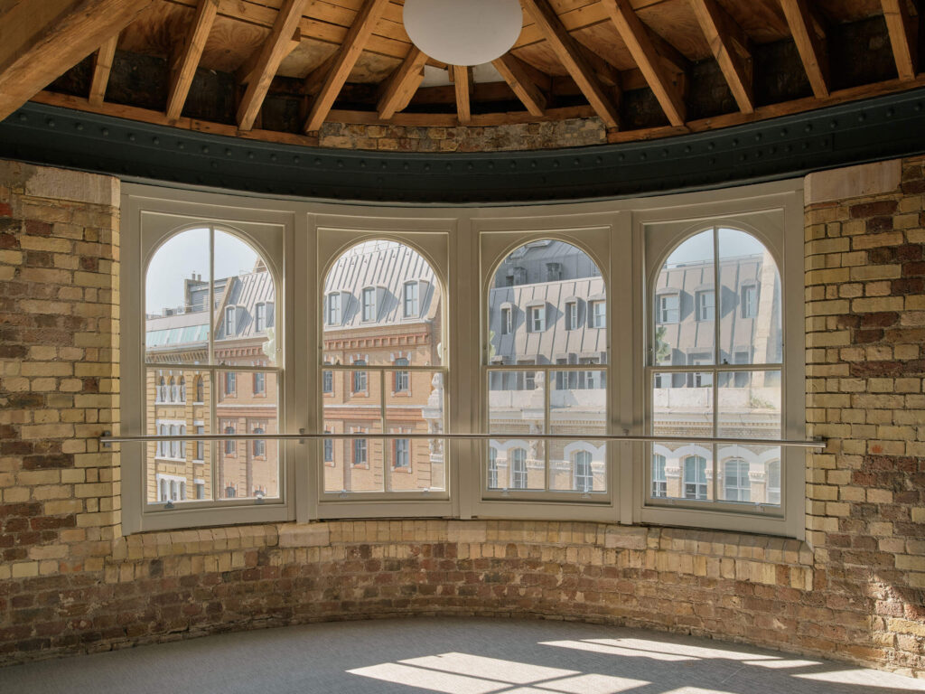 Menier Venues office with arched windows and brick interior